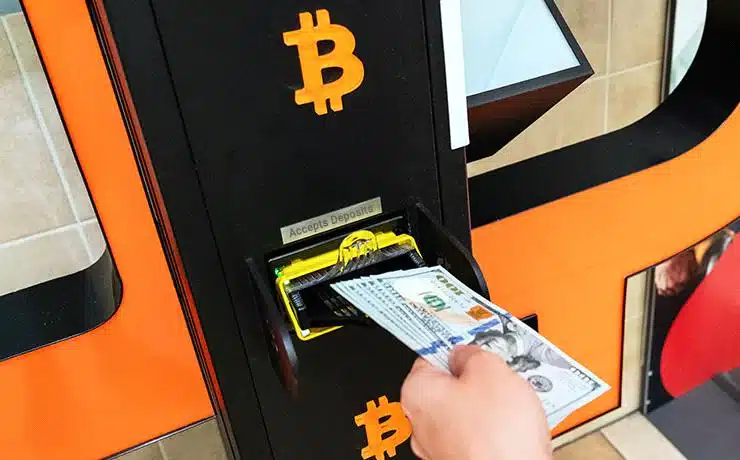 A customer making a Deposit in bitcoin atm
